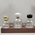 High End Hot Selling Empty 30 50 100ml  Thick Bottom Cylinder Glass Perfume Gold Silver Sprayer and Cap