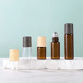 Empty 1ml 2ml 3ml Clear Amber Glass Essential Oil Dispenser Glass Roller Bottles with Dark Wood Grain Lid