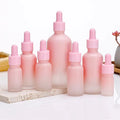 Hot Sale Luxury Matte Pink Glass Dropper Bottles Cylinder Shape 5ml 100ml Empty Liquid Serum Cream Packaging for Essential Oils
