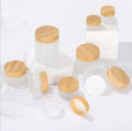 Low Moq Transparent Matte 30G 50G Cylinder Airtight Face Eye Cream Cosmetic Glass Jar with Bamboo Lids
