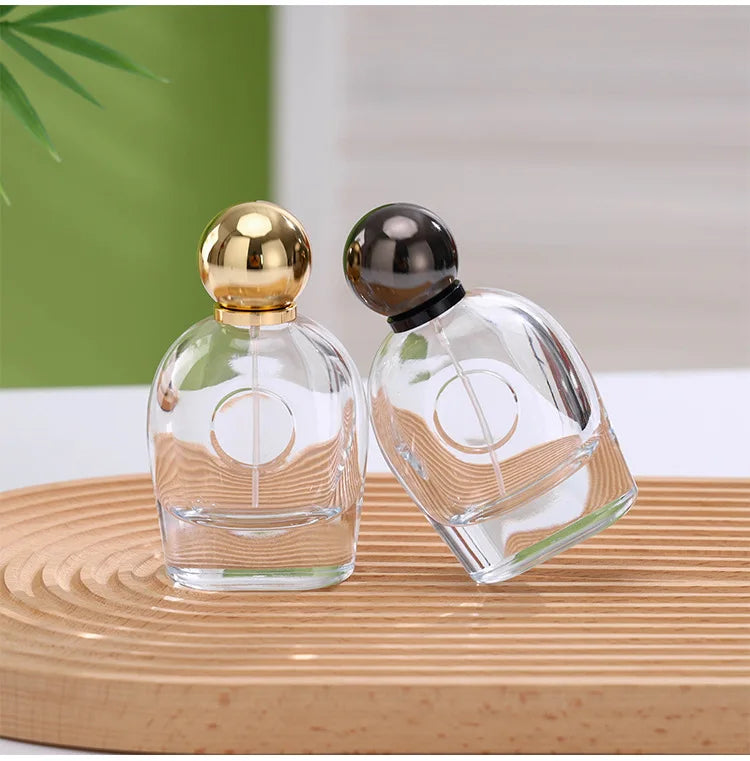 Wholesale New Design Oval Magnetic Ball Cap 80ml Crimp Perfume Glass Sprayer Bottles