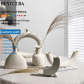 BESTCERA Hot Sales Round or Ceramic Flower Vase 4.5 Inch Ceramic White Pots Pottery Flower Hollow Oval Vase