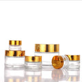 Wholesale 30g 50g 100g Luxury Empty Clear Frosted Cosmetics Glass Jar with Golden Cap and Inner Gasket