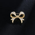 Elegant Gold-tone Bow Brooch with Alloy and Pearl Embellishments - Women's Stylish Scarf Suit Anti-Slip Pin for Individuality an