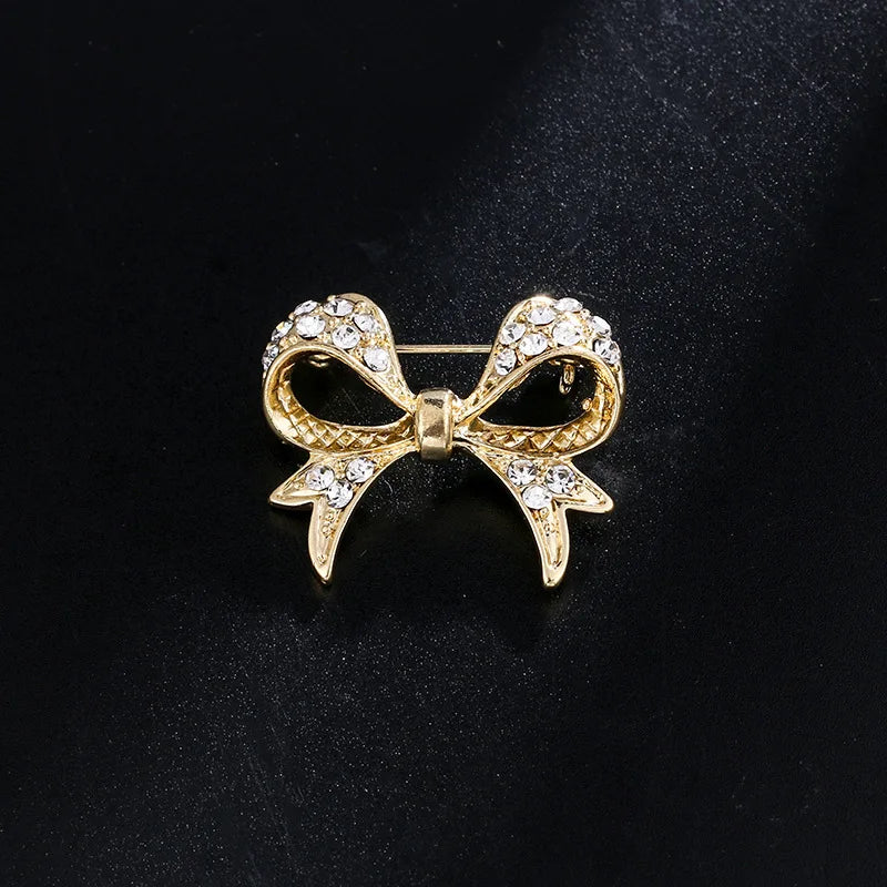 Elegant Gold-tone Bow Brooch with Alloy and Pearl Embellishments - Women's Stylish Scarf Suit Anti-Slip Pin for Individuality an
