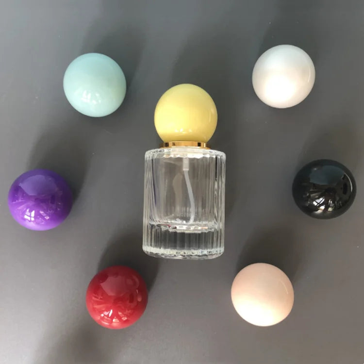 Wholesale 30 ml 50 ml 100 ml Round Cylinder Transparent Spray Glass Perfume Bottle with Lid
