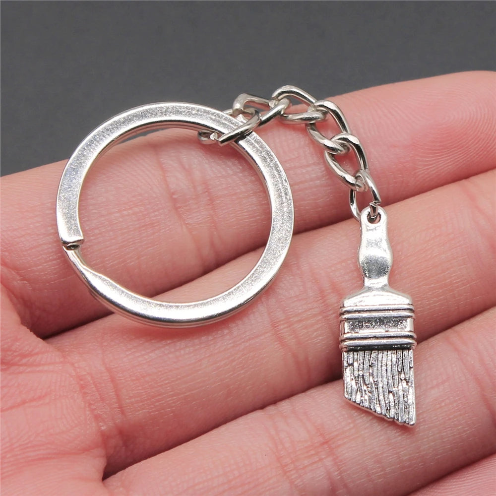 WYSIWYG 27x9mm Zinc Alloy Antique Silver Plated Paint Brush Key Chain Souvenirs Gift for Women P1-ABD-C10942