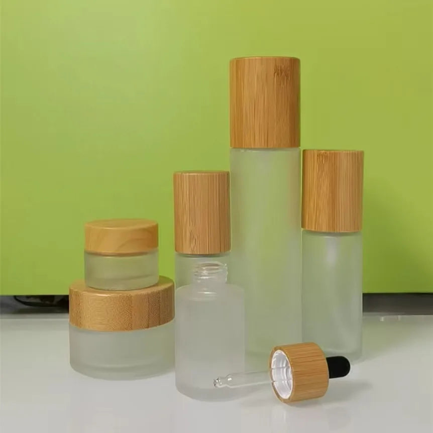 New Hot Sale 30ml 50ml 100ml 120ml 150ml Bamboo Lotion Pump Bottle Frosted Glass Bamboo Cap Spray Bottle Black Pump Head