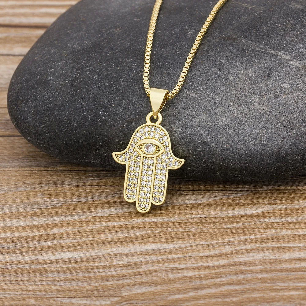 QIKU Wholesale Delicate Fashion Palm Hamsa Eye Hand Shape Pendant Necklace Copper Cubic Zircon Crystal White Rhinestone Jewelry
