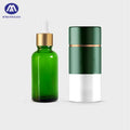 Factory Price 30Ml Clear Green Glass Essential Oil Dropper Serum Bottle with Pump Sprayer and Box