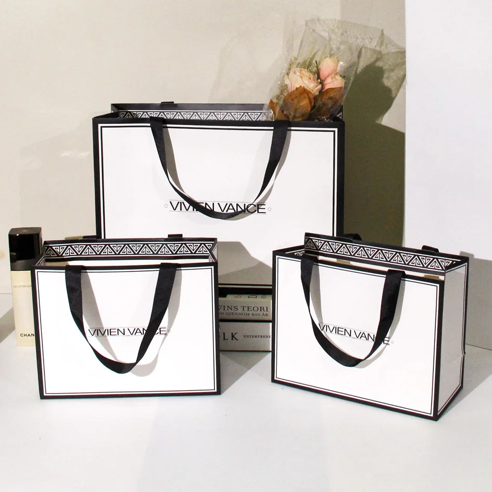 Customize Paper Bag With Logo Cardboard Luxury White Kraft Paper Gift Bag With Ribbon Handle for Shopping Bag With Your Own Logo