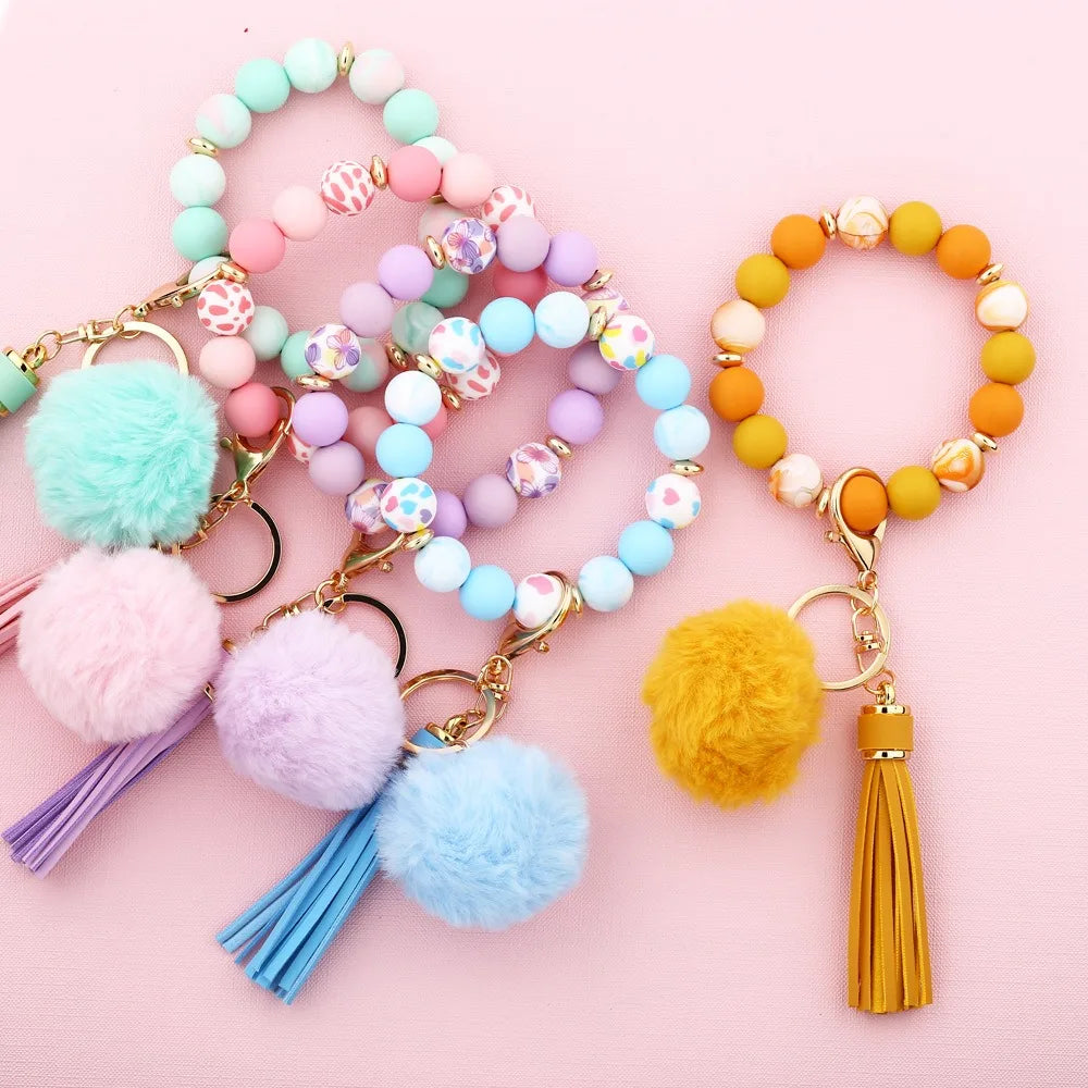 Colorful Silicone Bead Wrist Strap Bracelet Keychain PU Leather Tassel Plush Ball Anti-Lost Wristlet Keychain Doll Rechargeable