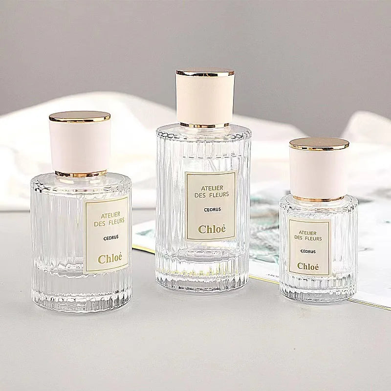 Luxury Fancy Flat Shoulder Cylinder Empty Refillable Screw Neck Clear Perfume Spray Bottle 50ml for Perfume Packaging