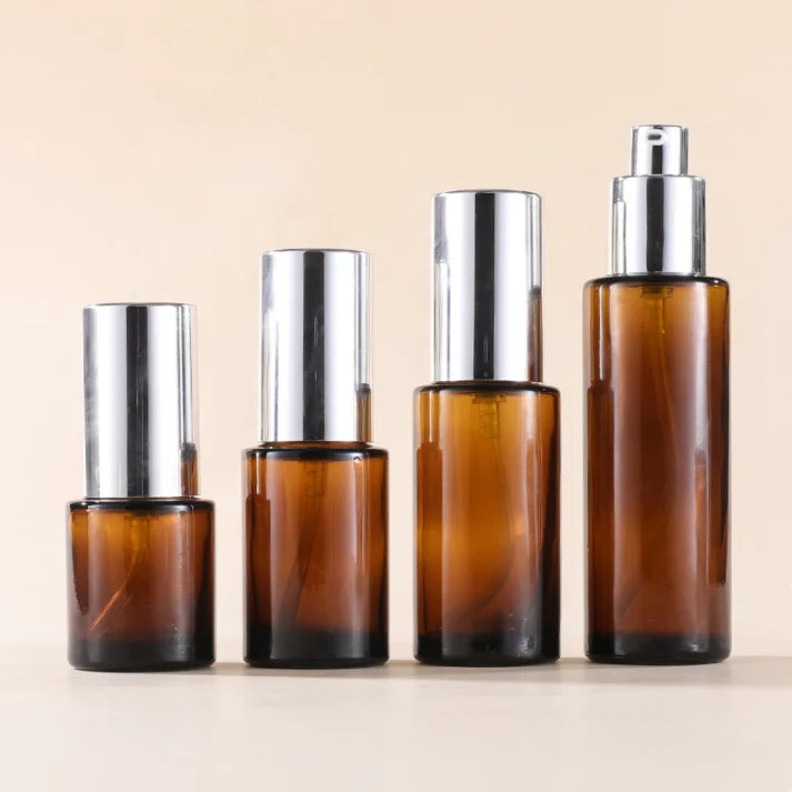 20ml 30ml 60ml 100ml Silver Cover Amber Brown Flat Lotion Serum Pump Bottle Empty Essential Oil Glass Bottles
