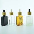 Hot Sell Frosted Black Square Glass Dropper Bottle for Essential Oil with Black and Bamboo Lid 15-100ml