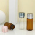 Jingtuo Wholesale Tubular Serum Glass Vial Bottles Round Glass Vials With Gold Top Screw Lid for Perfume