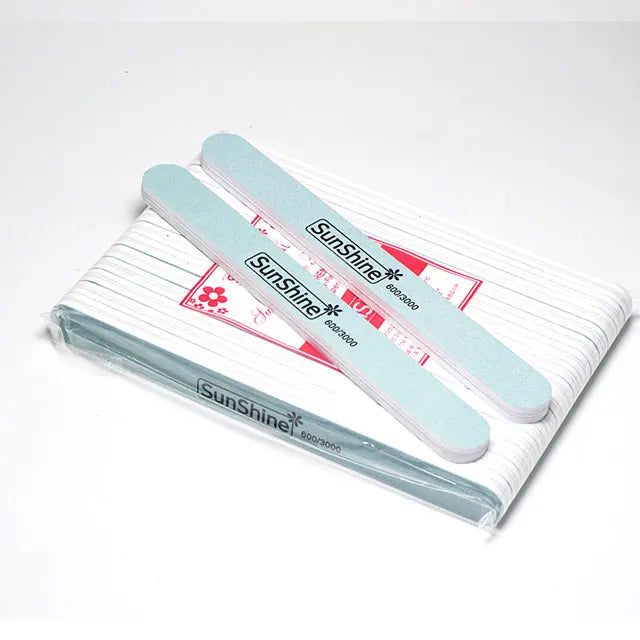 Mini Nail Care Polishing Tool with Nail File and Rubbing Strip Featuring a Nail Sponge Sanding Strip