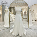 Ruolai QW01091 Appliqued Spaghetti Strap Sweep Train Pearls Illusion Button Backless Handwork Beaded Wedding Dresses