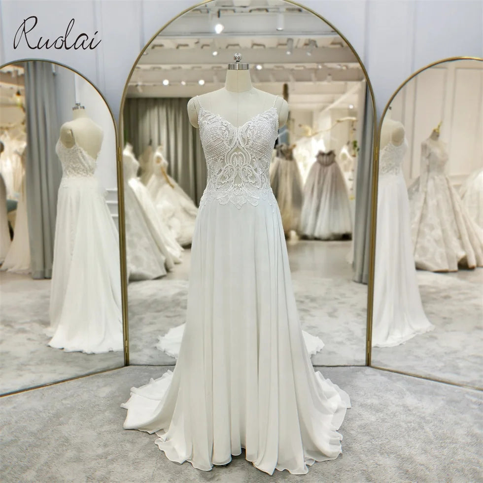 Ruolai QW01091 Appliqued Spaghetti Strap Sweep Train Pearls Illusion Button Backless Handwork Beaded Wedding Dresses