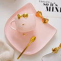 Lovely Golden Bow Handmade Ceramic Coffee Fashion White Milk Porcelain Tea Cup Set With Saucer and Spoon
