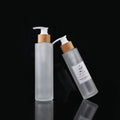 100ml 120ml 150ml Frost Glass Cylindrical Lotion Bottles with Bamboo Pump Cap for Cosmetic Packaging