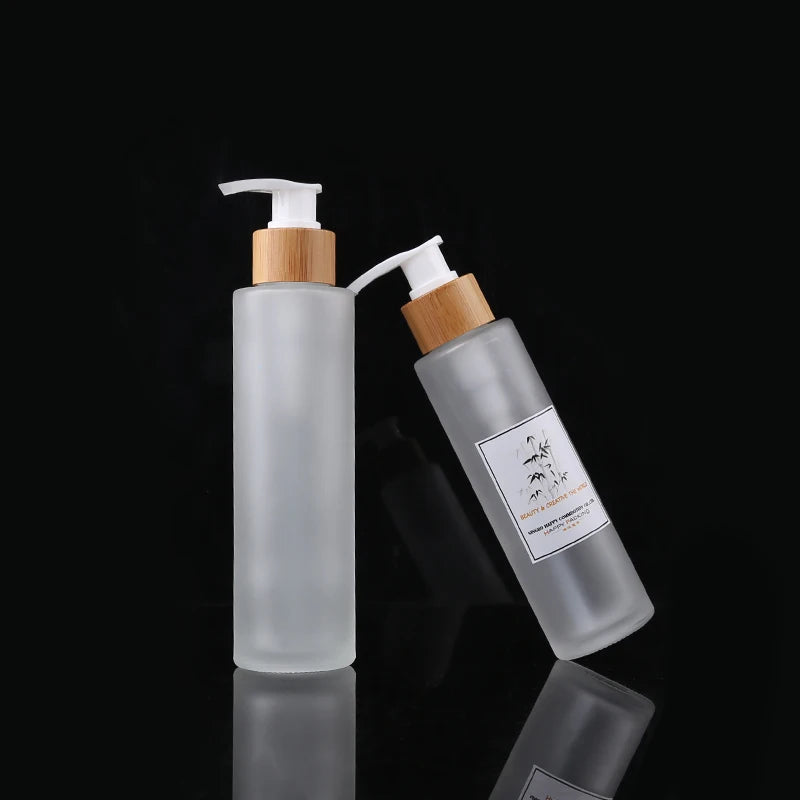 100ml 120ml 150ml Frost Glass Cylindrical Lotion Bottles with Bamboo Pump Cap for Cosmetic Packaging
