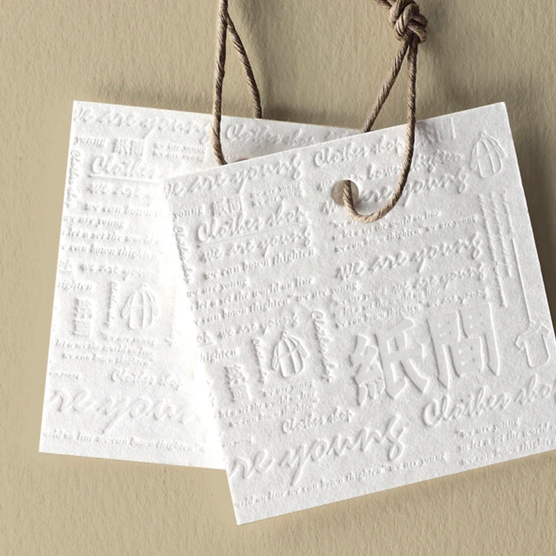 Luxury Eco-Friendly Clothing Garments Tags Custom Embossed Art Kapok Paper Hang Tag with Logo Label for Bags and Shoes