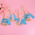 Hot Selling Blue Tassel Key Chain 26 English Letters Charm Simple Man and Woman Car Bag Gift Epoxy Resin Key Chain