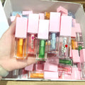 Hot Selling  OEM Label Vegan Lip Gloss Oil  Private Label Lip Oil Hyaluronic Strawberry Colorful Fruit Lip Oil