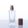 Wholesale Square Cylinder Perfume Bottle New Design Empty 30ml 50ml 100ml Clear with Wooden Cap Hot Stamping Pump Sprayer