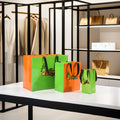Vibrant Green & Orange Gloss Lamination Custom Paper Bag Print Pineapple Logo Gift Bag Retail Lifestyle Brand Packaging Solution