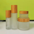 Eco-Friendly Bamboo Wood Cosmetic Packaging 1oz30ml50ml100ml Frosted Clear Glass Cream Jar Lotion Pump Bottle with Bamboo Cap