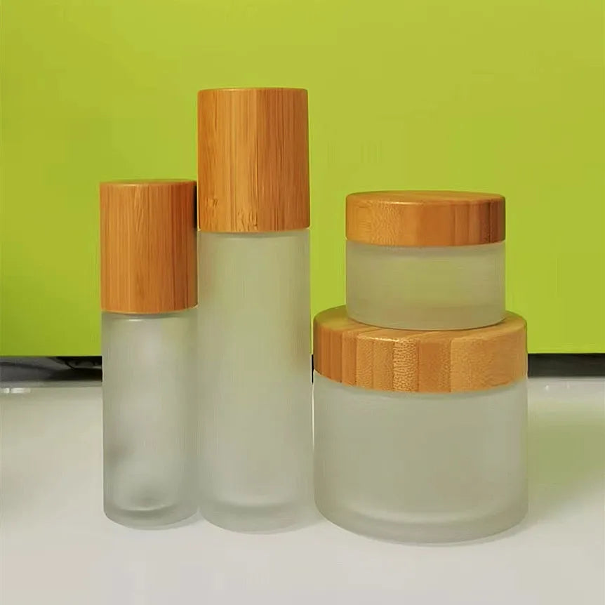 Eco-Friendly Bamboo Wood Cosmetic Packaging 1oz30ml50ml100ml Frosted Clear Glass Cream Jar Lotion Pump Bottle with Bamboo Cap