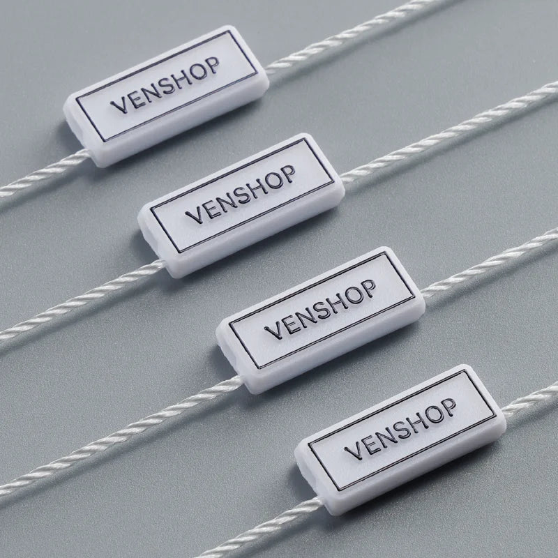 OEM/ODM High Quality Eco-Friendly Regular Ironing Gold Garment Tag English Letter Particle Paper Swinging Hanging for Bags Shoes
