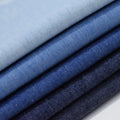 Factory Price 100% Cotton Twill Woven Washed Bulk Denim Fabric 32S 4.5oz Plain Style Yarn Dyed for Boys and Girls Shoes