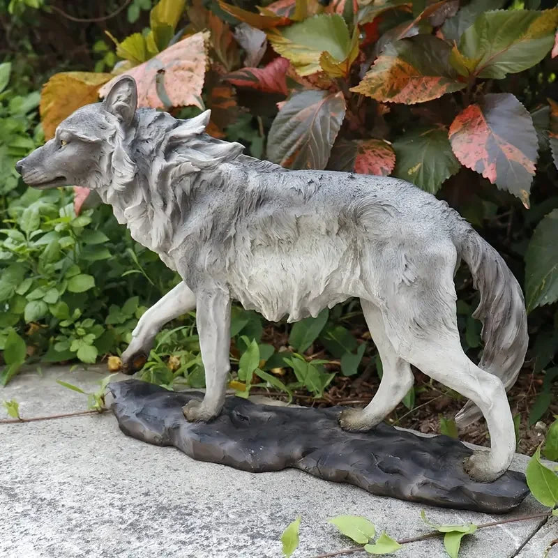 Realistic Wolf in Motion Resin Sculpture Standing Gray Wolf Statue on Natural Rock Base Wilderness Themed Decor for Garden