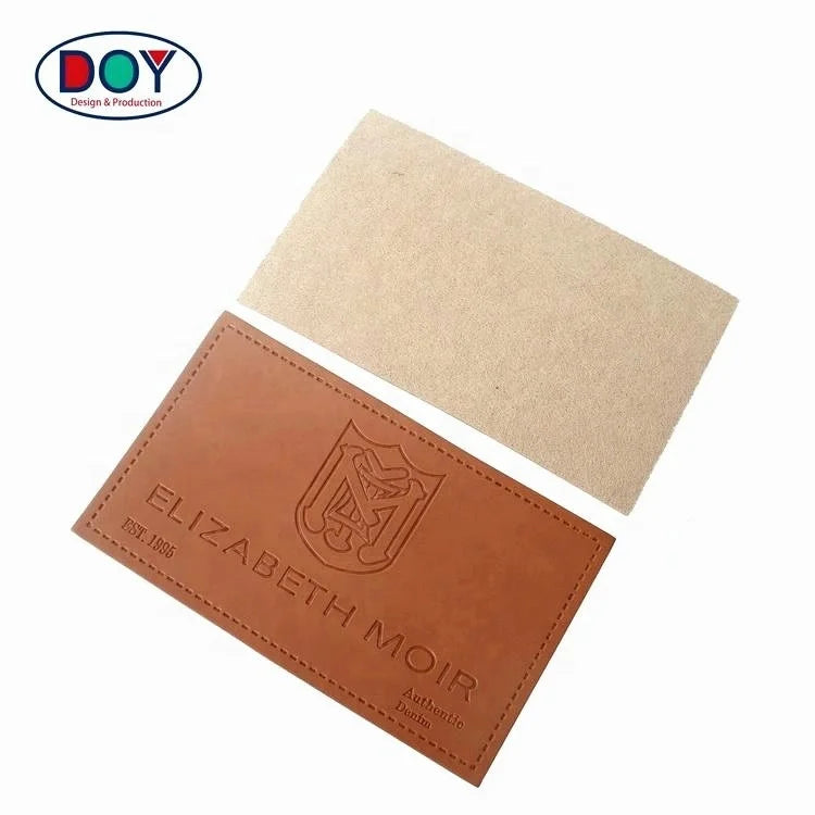 Design Custom Debossed Brand Logo PU Leather Clothing Labels for Jeans