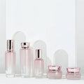 Custom logo 30g 50g 40ml 100ml 120ml Gradual pink Glass Bottle with Gold Rose Cap for Personal Care Cosmetic Package Container