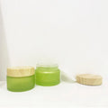 Customize Color Olive Green Cosmetic Green Jar Face Cream Container Frosted Glass Jar with Plastic Lid in Wood Color