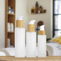 Hot Selling 100ml Frosted Glass Cream Jar Bamboo Pump Lid 60ml Capacity Cylinder Shape Screw Collar PP Polished Perfumed Packing