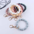 Custom Elastic Silicone Beads Bangle Bracelet Keychain PU Leather Tassel Wristlet with Doll Pattern Safe Feature