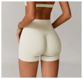 High waisted and hip lifting yoga shorts for women wearing tight fitting and slimming running sports shorts