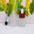 Flat Shoulder Luxury Cosmetic Glass Bottles with Black Wooden Lid