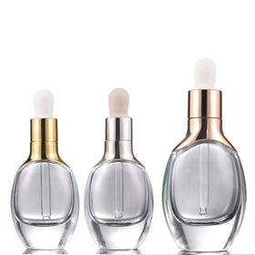 Unique Design Face Serum Skincare Glass Dropper Bottle Oval Shape clear Glass Dropper Bottle with Rose Gold Should Sleeve