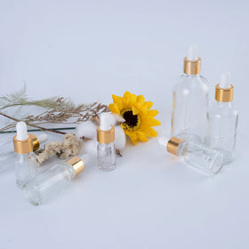 Luxury 5ml 10ml 15ml 20ml 30ml 50ml 100ml Clear Oil Glass Dropper Bottle with Gold Cap and White Rubber for Skincare Packaging