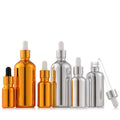 Wholesale 5ml 10ml 15ml 20ml 30ml 50ml 100ml Gold/Silver UV Colored Glass Bottle Dropper Essential Oil Bottle