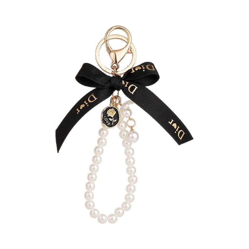 Factory Direct Wholesale Letter Bow Pearl Metal Car Keychain Women's Bag Accessories Pendant Small Gift