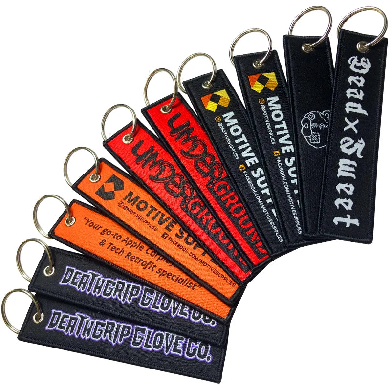 Hot Sale Cheap Anime Design Key Tag Woven Motorcycle Flight Label Jet Tag Fabric Woven Brand Embroidered Keychain