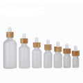 Custom Empty Frosted Glass Dropper Bottle With Bamboo Lid 10ml 20ml 30ml 50ml Refillable Essential Oils Serum Dropper Bottles