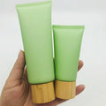 In Stock Cosmetics Soft Tube Matte Green Face Cleaner Hand Cream Empty clear Tube with Bamboo Cap 50g 100g 200g